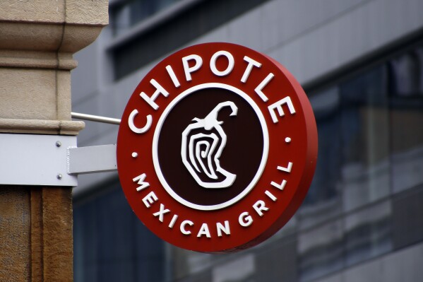 FILE - A sign for the Chipotle restaurant in Pittsburgh's Market Square is pictured Feb. 8, 2016. Last week, the Newport Beach, California-based Mexican chain asked its U.S. and Canadian employees to temporarily select another protein option for their meals to preserve its supply of chicken. But the chain said Thursday, April 25, 2024, that employees can go back to eating chicken again. (AP Photo/Keith Srakocic, File)
