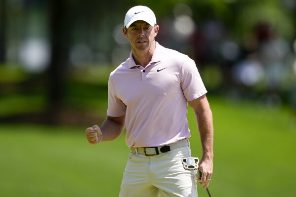 Rory McIlroy, of Northern Ireland, celebrates after a par on the third hole during the final round of the Wells Fargo Championship golf tournament at the Quail Hollow Club Sunday, May 12, 2024, in Charlotte, N.C. (AP Photo/Chris Carlson)