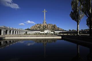 FILE - The Valley of the Fallen mausoleum, near El Escorial, outskirts of Madrid, Spain, on Oct. 13, 2019. Spain’s armed forces have fired an army captain after a video was posted on social media showing some 30 soldiers kneeling in front of the Valley of the Fallen mausoleum, the most potent existing symbol of the dictatorship of late Gen. Francisco Franco. The Defense Ministry said Thursday the captain was dismissed within hours of the video being posted and that an investigation was underway. (AP Photo/Manu Fernandez)