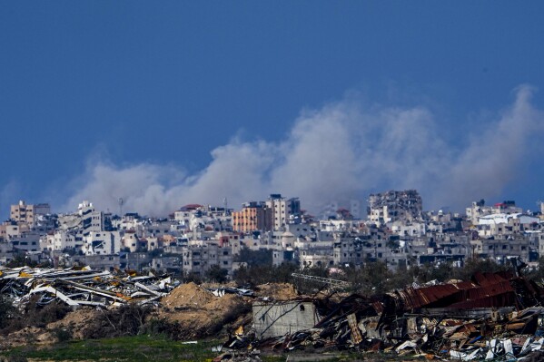 Smoke rises following an Israeli bombardment in the Gaza Strip, as seen from southern Israel, Sunday, Feb. 4, 2024. The army is battling Palestinian militants across Gaza in the war ignited by Hamas' Oct. 7 attack into Israel. (AP Photo/Ariel Schalit)