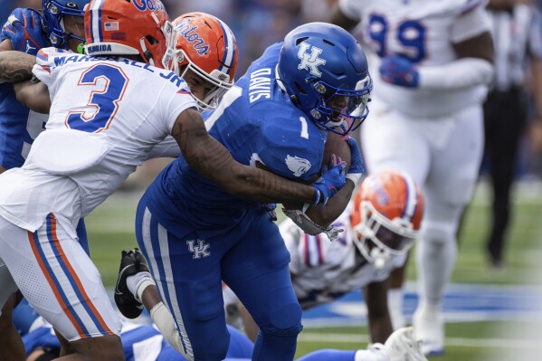 Florida cornerback Jason Marshall Jr. (3) pressures Kentucky running back Ray Davis (1) during the second half of an NCAA college football game in Lexington, Ky., Saturday, Sept. 30, 2023. (AP Photo/Michelle Haas Hutchins)