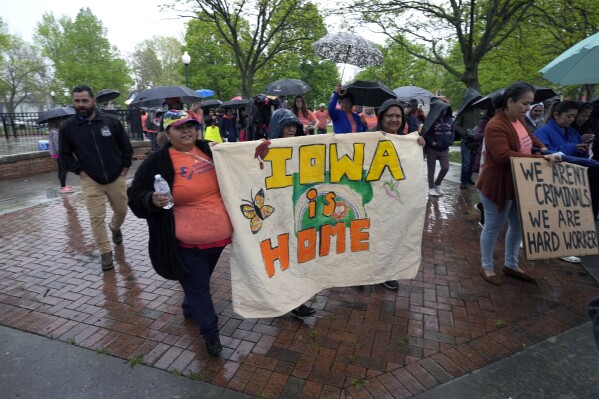 People march during an Iowa Movement for Migrant Justice rally and march, Wednesday, May 1, 2024, in Des Moines, Iowa. (AP Photo/Charlie Neibergall)