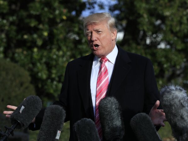 
              President Donald Trump speaks to reporters before leaving the White House, Tuesday, Nov. 21, 2017, in Washington, for a Thanksgiving trip to Mar-a-Lago estate in Palm Beach, Fla. Silent for more than a week, Trump all but endorsed embattled Alabama Republican Senate nominee Roy Moore, discounting the sexual assault allegations against him and repeatedly insisting voters must not support Moore's "liberal" rival. (AP Photo/Manuel Balce Ceneta)
            