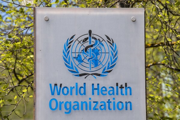 FILE - The logo and building of the World Health Organization (WHO) headquarters in Geneva, Switzerland, April 15, 2020. (Martial Trezzini/Keystone via AP, file)