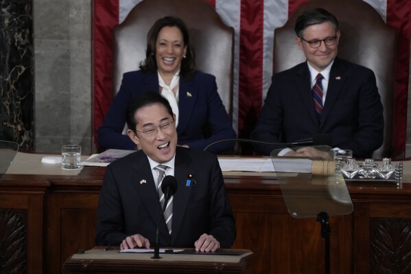 Japan's Prime Minister Fumio Kishida addresses a joint meeting of Congress in the House chamber, Thursday, April 11, 2024, at the Capitol in Washington, as Vice President Kamala Harris and Speaker of the House Mike Johnson, R-La., look on. (AP Photo/Jacquelyn Martin)