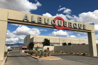 FILE - In this Oct. 8, 2018, file photo, is the entrance to ABQ Studios in Albuquerque, N.M., where Netflix announced at the studio complex that it chose Albuquerque as a new production hub. Netflix is pledging an additional $1 billion investment in its production hub in New Mexico. The company joined government officials Monday, Nov. 23, 2020, in announcing its plans. The expansion will add about 300 acres to the existing campus on the southern edge of Albuquerque, making it what officials say will be one of the largest film production facilities in North America. (AP Photo/Susan Montoya Bryan, File)