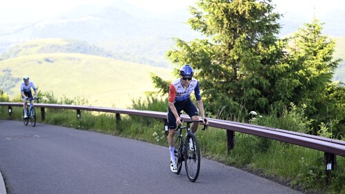 Canada's Michael Woods overtakes Matteo Jorgenson of the U.S., left, on the climb to Puy de Dome during the ninth stage of the Tour de France cycling race over 182.5 kilometers (113.5 miles) with start in Saint-Leonard-de-Noblat and finish in Puy de Dome, France, Sunday, July 9, 2023. (Vincent Kalut, Pool via AP)