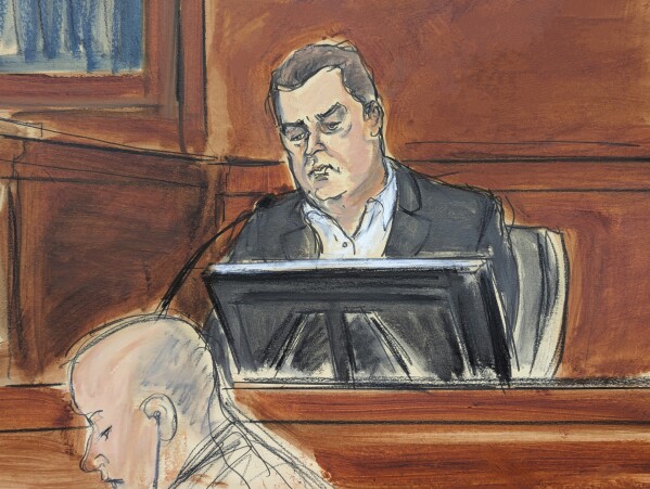 George Kaplan, Sean "Diddy" Combs' former personal assistant, testifies on the witness stand during Sean "Diddy" Combs' sex trafficking and racketeering trial in Manhattan federal court, Wednesday, May 21, 2025, in New York. (Elizabeth Williams via AP)