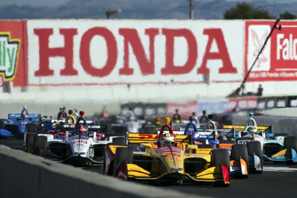 FILE - Ryan Hunter-Reay (28) leads in the Verizon IndyCar Grand Prix of Sonoma auto race, Sunday, Sept. 16, 2018, in Sonoma, Calif. Honda, not unlike many of the team owners, have concerns about a sense of stagnancy in a series that is otherwise a fantastic racing product. The decision by IndyCar to delay the introduction of a new hybrid engine until after the Indy 500 in May, didn't make anyone happy. (AP Photo/Elijah Nouvelage, File)