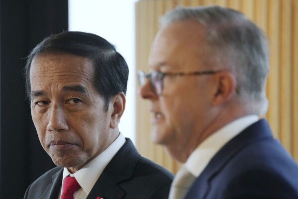 Indonesian President Joko Widodo, left, looks at Australian Prime Minister Anthony Albanese during a joint statement in Sydney, Tuesday, July 4, 2023. Widodo is on a 3-day visit to Australia. (AP Photo/Rick Rycroft)