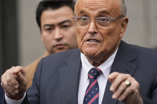 Rudy Giuliani speaks to reporters as he leaves the federal courthouse in New York, Tuesday, Nov. 26, 2024. (AP Photo/Seth Wenig)