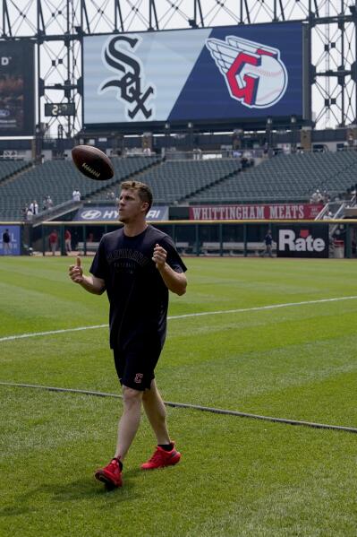 Cleveland Guardians OF Myles Straw Throws Football With New York