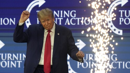 Former President Donald Trump dances on stage at the Turning Point Action conference, Saturday, July 15, 2023, in West Palm Beach, Fla. (AP Photo/Lynne Sladky)