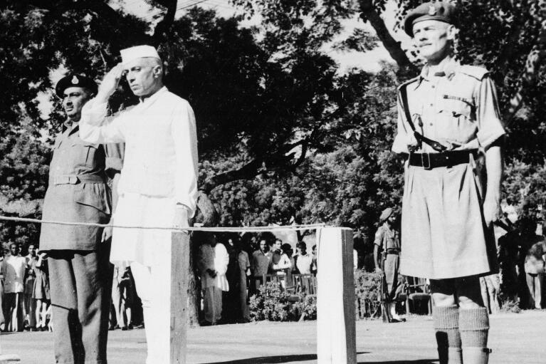 FILE - Jawaharlal Nehru salutes the flag as he becomes independent India's first prime minister on Aug. 15, 1947 during the Independence Day ceremony at Red Fort, New Delhi, India. “At the stroke of the midnight hour, when the world sleeps, India will awake to life and freedom," Nehru famously spoke, words that were heard over live radio by millions of Indians. Then he promised: “To the nations and peoples of the world, we send greetings and pledge ourselves to cooperate with them in furthering peace, freedom and democracy.” (AP Photo/File)