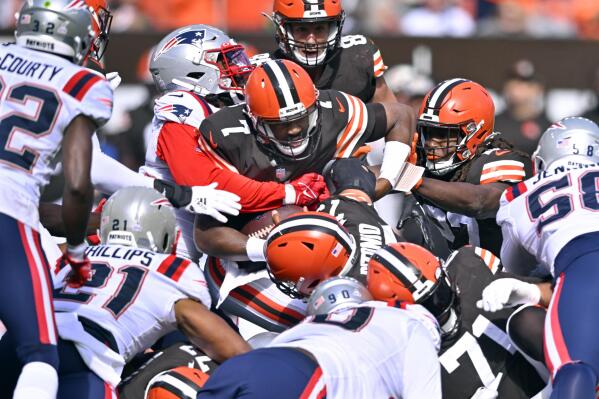 Cleveland Browns quarterback Jacoby Brissett (7) is stopped by the New England Patriots defense on a fourth down effort during the first half of an NFL football game, Sunday, Oct. 16, 2022, in Cleveland. Brisset came up short and the ball was turned over to the Patriots. (AP Photo/David Richard)