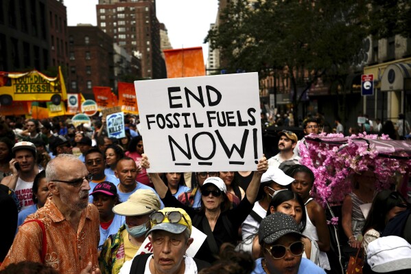 Climate activists attend a rally to end fossil fuels, in New York, Sunday, Sept. 17, 2023. (AP Photo/Bryan Woolston)