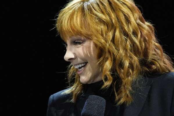 Reba McEntire speaks during a news conference ahead of the Super Bowl 58 NFL football game Thursday, Feb. 8, 2024, in Las Vegas. (AP Photo/John Locher)