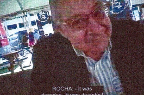 This image provided by the Justice Department and contained in the affidavit in support of a criminal complaint, shows Manuel Rocha during a meeting with a FBI undercover employee. The Justice Department says Rocha, a former American diplomat who served as U.S. ambassador to Bolivia, has been charged with serving as a covert agent for Cuba's intelligence services since at least 1981. Newly unsealed court papers allege that Manuel Rocha engaged in "clandestine activity" on Cuba's behalf for decades, including by meeting with Cuban intelligence operatives. (Justice Department via AP)