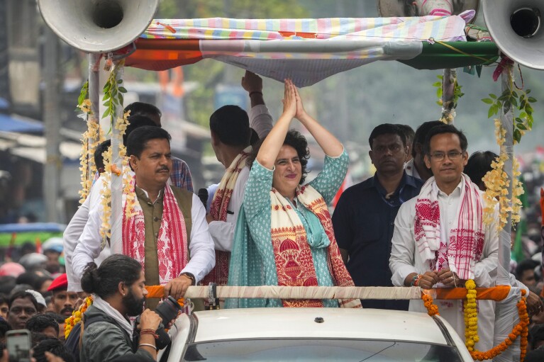 India's Congress party leader Priyanka Gandhi waves during a road show as she campaigns for the upcoming national elections in Titabor in upper Assam, India, Tuesday, April 16, 2024. (AP Photo/Anupam Nath)