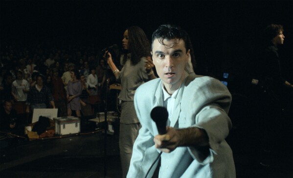 This image released by A24 shows David Byrne in a scene from "Stop Making Sense." (Jordan Cronenweth/A24 via AP)