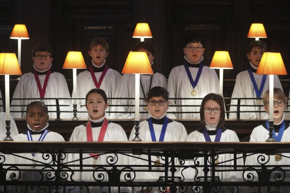 The Choristers of St Paul's choir, including girls for first time in 900-year history, rehearse for the Christmas services in St Paul's Cathedral, in London, Monday, Dec. 23 2024. (AP Photo/Kin Cheung)
