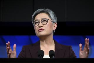 Australian Foreign Minister Penny Wong addresses the National Press Club in Canberra, Monday, April 17, 2023. Australia was working to stabilize relations with China but could not return to the thriving economic relationship with its biggest trading partner that existed 15 years ago, Wong said. (Lukas Coch/AAP Image via AP)