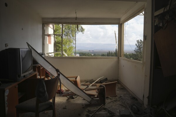 Damage is seen at the site where a rocket fired from Lebanon hit a residential building in Kiryat Shmona, a town located near the border with Lebanon, in northern Israel, Wednesday, Nov. 20, 2024. (AP Photo/Ohad Zwigenberg)