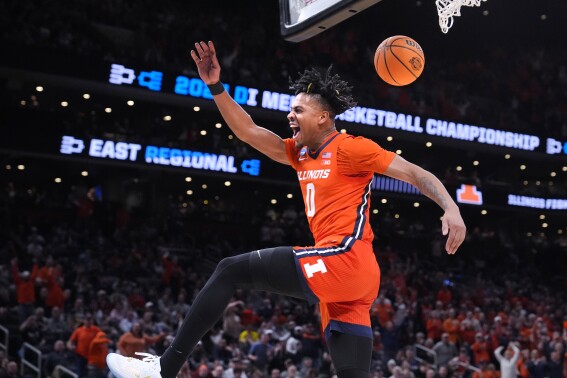 Illinois guard Terrence Shannon Jr. celebrates after his dunk against Iowa State during the first half of the Sweet 16 college basketball game in the men's NCAA Tournament, Thursday, March 28, 2024, in Boston. (AP Photo/Steven Senne)