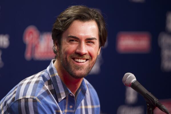 FILE - Former Philadelphia Phillies starting pitcher Cole Hamels takes questions from the media after being traded to the Texas Rangers prior to the first inning of a baseball game against the Atlanta Braves on July 31, 2015, in Philadelphia. The former Phillies ace and 2008 World Series MVP is eyeing a comeback in 2023. (AP Photo/Chris Szagola, File)