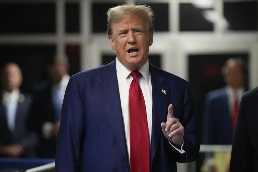 Former President Donald Trump speaks upon arriving at Manhattan criminal court, Tuesday, April 30, 2024, in New York. (AP Photo/Seth Wenig, Pool)