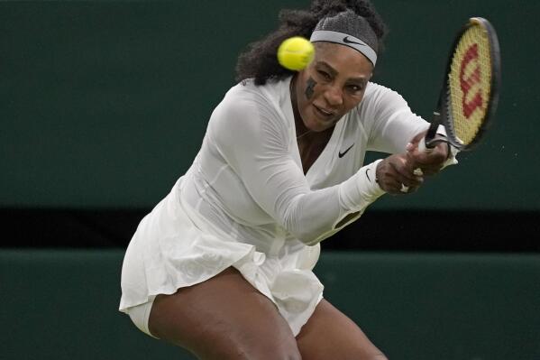 Serena Williams of the US returns to France's Harmony Tan in a first round women's singles match on day two of the Wimbledon tennis championships in London, Tuesday, June 28, 2022. (AP Photo/Alberto Pezzali)