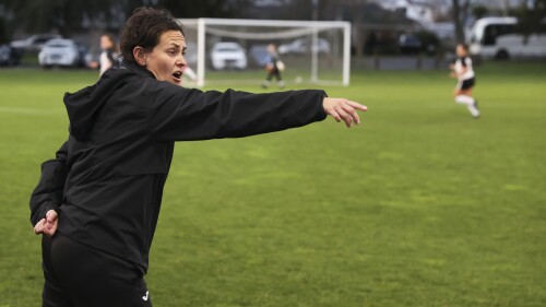 Youth coach Tarena Ranui gives directions during a girls soccer game in Hamilton, New Zealand, Monday, July 24, 2023. Maori youth coach, Ranui, is among those leading the charge to change the landscape of soccer in New Zealand. (AP Photo/Luke Vargas)