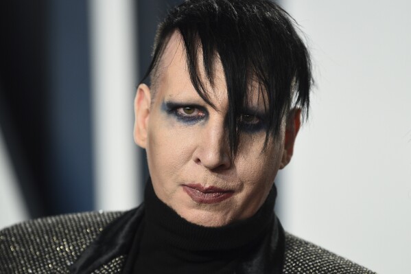 FILE - Marilyn Manson arrives at the Vanity Fair Oscar Party, Feb. 9, 2020, in Beverly Hills, Calif. (Photo by Evan Agostini/Invision/AP, File)