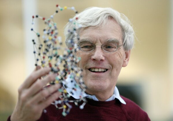 
              Richard Henderson, one of the 2017 Nobel Prize winners in Chemistry, holds a bacterio rhodopsin model prior to a press conference at the Laboratory of Molecular Biology in Cambridge, England, Wednesday, Oct. 4, 2017. Three researchers based in the U.S., U.K. and Switzerland won the Nobel Prize in Chemistry on Wednesday for developments in electron microscopy. The 9-million-kronor ($1.1 million) prize is shared by Jacques Dubochet of the University of Lausanne, Joachim Frank at New York's Columbia University and Richard Henderson of MRC Laboratory of Molecular Biology in Cambridge, Britain. (AP Photo/Frank Augstein)
            