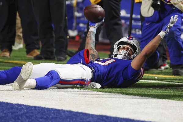 Buffalo Bills wide receiver Khalil Shakir (10) reacts after making a touchdown catch against the Kansas City Chiefs during the third quarter of an NFL AFC division playoff football game, Sunday, Jan. 21, 2024, in Orchard Park, N.Y. (AP Photo/Jeffrey T. Barnes)