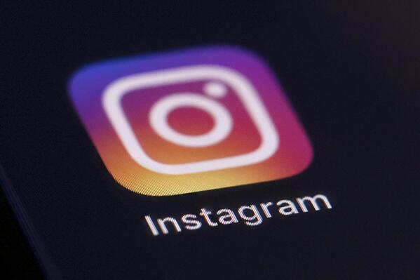 FILE - This Friday, Aug. 23, 2019, file photo shows the Instagram app icon on the screen of a mobile device in New York. Bowing to pressure from lawmakers, critics, the media and child development experts, Facebook said Monday, Sept. 27, 2021, it will “pause" its work on a kids' version of its photo-oriented Instagram app. (AP Photo/Jenny Kane, File)