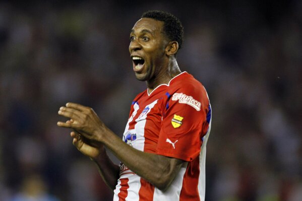 FILE - In this Feb. 24, 2011 file photo, Jhon Viafara of Colombia's Junior de Barranquilla celebrates after scoring against Brazil's Gremio during a Copa Libertadores soccer match in Barranquilla, ...