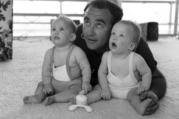 This photo provided by Matthew Asner shows his father, Ed and his sister, Liza, and him at home in Studio City, Calif., in 1963. After Ed Asner died in 2021, Matthew, found hundreds of undeveloped negatives. He decided to get them digitized along with a storehouse of printed pictures. “I honestly didn’t know what I was going to get back,” he says. “It’s kind of overwhelming. It’s like you get this treasure back that opens your eyes to a past that you sort of remember. But a lot of it you don’t remember.” (Nancy Asner via AP)