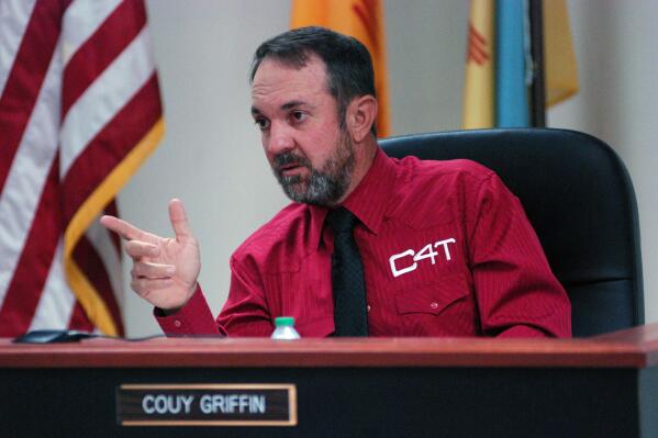 FILE - In this May 13, 2021, file photo, Otero County Commissioner Couy Griffin presides at a public meeting in Alamogordo, N.M., in a shirt with a "C4T" logo that stands for Cowboys for Trump. Time is running out for a petition drive to recall Cowboys for Trump founder Couy Griffin from office as a county commissioner in southern New Mexico. Backers of the petition drive in Otero County say they still need to collect several hundred additional signatures by next Wednesday to trigger a special recall election against Griffin.(AP Photo/Morgan Lee, File)