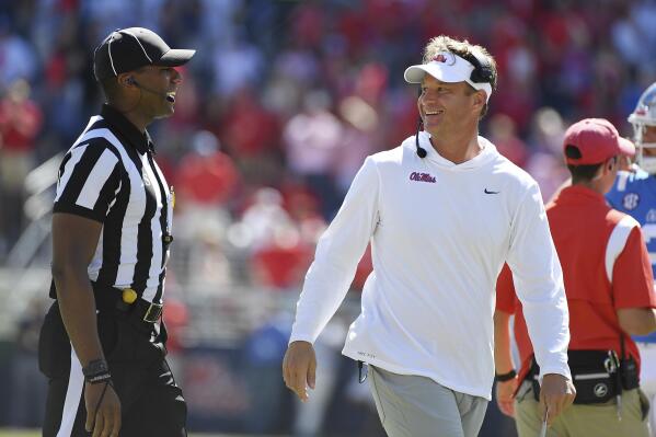 Mississippi head coach Lane Kiffin talks with an official during the second half of an NCAA college football game against Kentucky in Oxford, Miss., Saturday, Oct. 1, 2022. Mississippi won 22-19. (AP Photo/Thomas Graning)