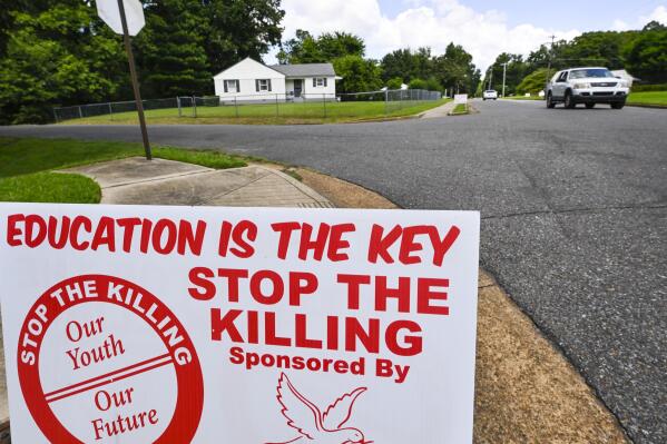 A sign is present at a street in the neighborhood of Whitehaven where a gunman was arrested, whom livestreamed himself driving around shooting at people, killing four and wounding three others in seemingly random attacks last night, shown Thursday, Sept. 8, 2022, in Memphis, Tenn. (AP Photo/John Amis)