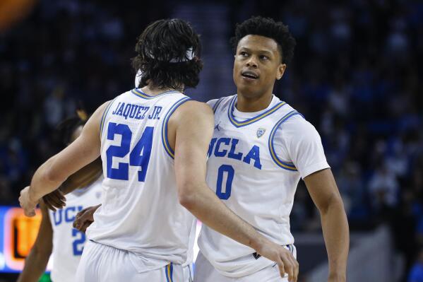 UCLA guards Jaylen Clark, right, celebrates with Jaime Jaquez Jr. after scoring a 3-pointer against Stanford during the second half of an NCAA college basketball game Thursday, Feb. 16, 2023, in Los Angeles. UCLA won 73-64. (AP Photo/Ringo H.W. Chiu)