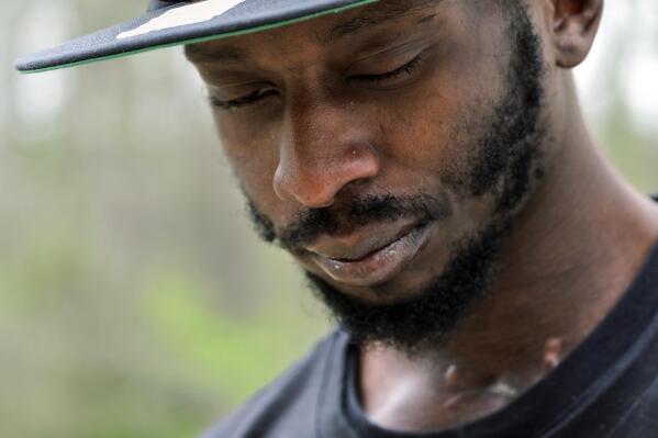 FILE - Michael Corey Jenkins stands outside Taylor Hill Church in Braxton, Miss., March 18, 2023. Two Black men — one of whom was shot in the mouth by a law enforcement officer — will file a federal civil rights lawsuit against a Mississippi sheriff’s department alleging a pattern of deputies using excessive force against Black people. In a news release announcing the lawsuit, on Tuesday, June 6, 2023, attorneys for Jenkins and Eddie Terrell Parker said they would bring forward 22 claims of federal civil rights violations. (AP Photo/HG Biggs, file)