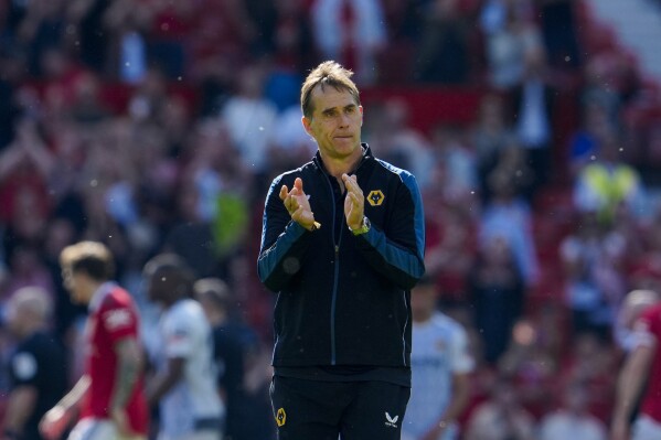FILE - Wolverhampton Wanderers' head coach Julen Lopetegui applauds at the end of their English Premier League soccer match against Manchester United at the Old Trafford stadium in Manchester, England, Saturday, May 13, 2023. Lopetegui has left his position as Wolverhampton manager after nine months in charge and less than a week before the start of the Premier League season, it was announced Tuesday, Aug. 8. The former Spain and Real Madrid coach was reportedly unhappy with the club’s financial situation. (AP Photo/Jon Super, file)