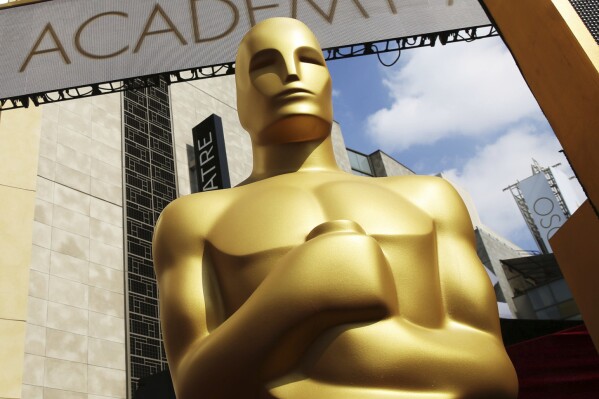 FILE - An Oscar statue appears outside the Dolby Theatre for the 87th Academy Awards in Los Angeles on Feb. 21, 2015. The film academy takes a special interest in helping filmmakers at the beginning of their careers throughout the year, and one of their most important showcases is the Student Academy Awards which celebrated its 50th anniversary this year. (Photo by Matt Sayles/Invision/AP, File)