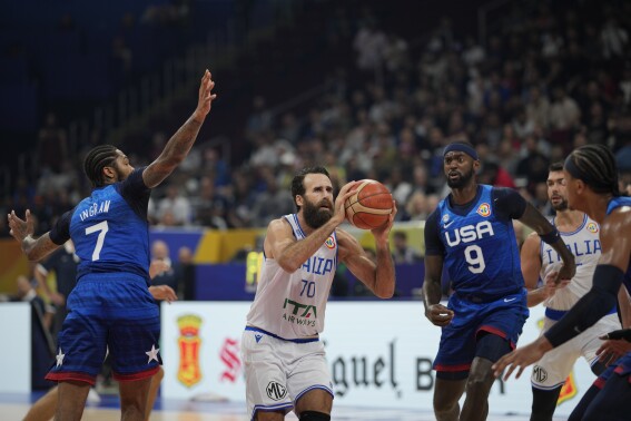 Italy forward Luigi Datome (70) shoots during the Basketball World Cup quarterfinal game between Italy and U.S. at the Mall of Asia Arena in Manila, Philippines, Tuesday Sept. 5, 2023. (AP Photo/Aaron Favila)