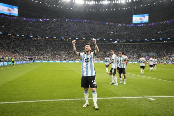 Argentina's Lionel Messi celebrates after scoring his side's opening goal during the World Cup group C soccer match between Argentina and Mexico, at the Lusail Stadium in Lusail, Qatar, Saturday, Nov. 26, 2022. (AP Photo/Ariel Schalit)