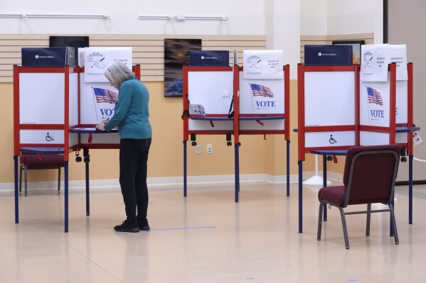 A voter fills out a ballot at a polling place, Tuesday, March 5, 2024, in Attleboro, Mass. (AP Photo/Steven Senne)