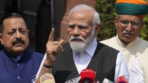 Indian Prime Minister Narendra Modi speaks as he arrives on the opening day of the monsoon session of the Indian parliament in New Delhi, India, Thursday, July 20, 2023. Modi Thursday broke more than two months of his public silence over the deadly ethnic clashes that have marred the country's remote northeast Manipur state, a day after a viral video showed two women being paraded naked by a mob, sparking outrage across the nation. (AP Photo/Manish Swarup)