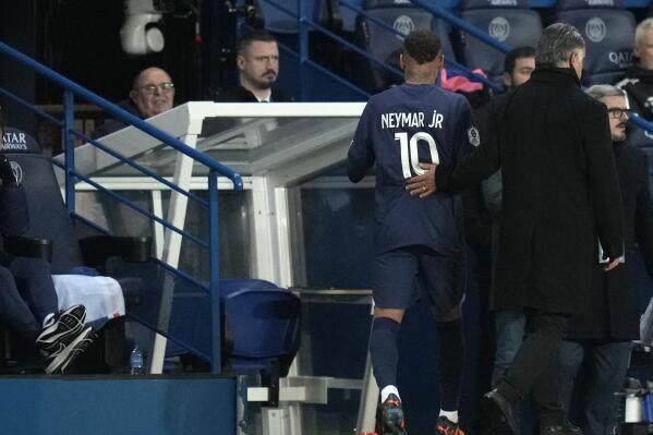 PSG's Neymar leaves the pitch after being shown a red card during the French League One soccer match between Paris Saint-Germain and Strasbourg at the Parc des Princes in Paris, Wednesday, Dec. 28, 2022. (AP Photo/Thibault Camus)